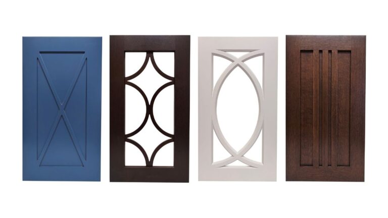 A variety of custom doors. From left to right: a blue door with an X detail on the panel; a stained open frame door with a mullion insert; a white mullion frame; and a stained door with 3 vertical mullion bars on the panel.