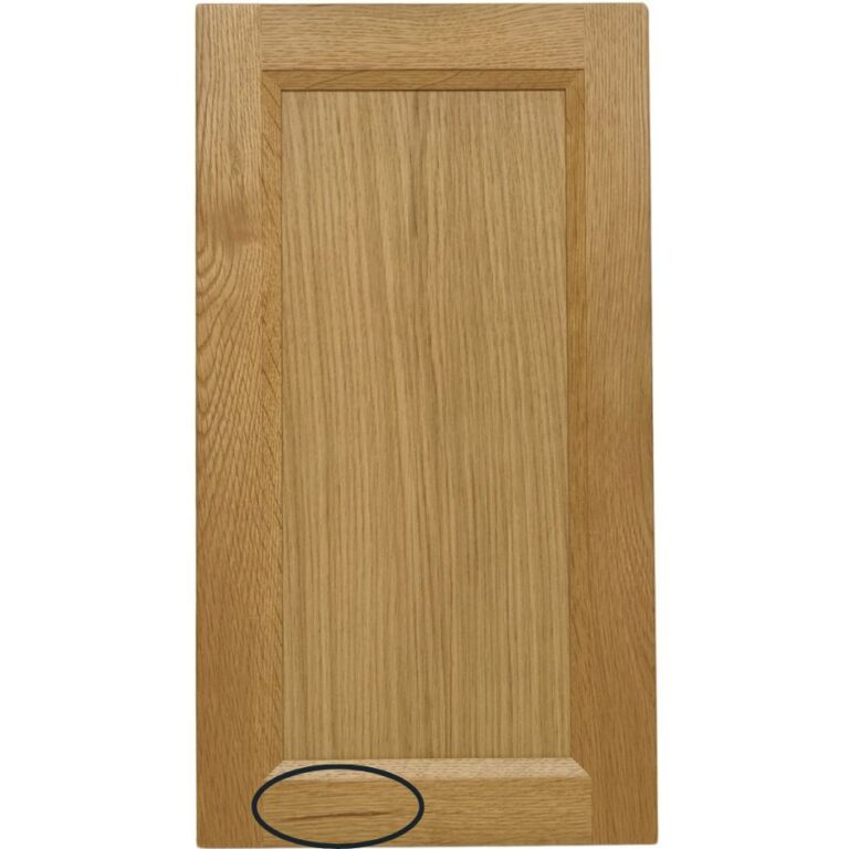 A builder grade cabinet door with a mineral streak circled.
