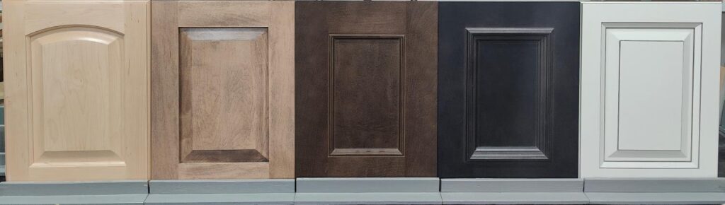 5 Maple doors. From left to right, a clear lacquer finish, a light stain finish, a medium stain finish, a dark stain finish, and a painted finish.