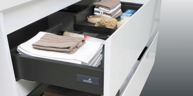 Hettich makes metal drawer boxes, like the one shown here containing towels.