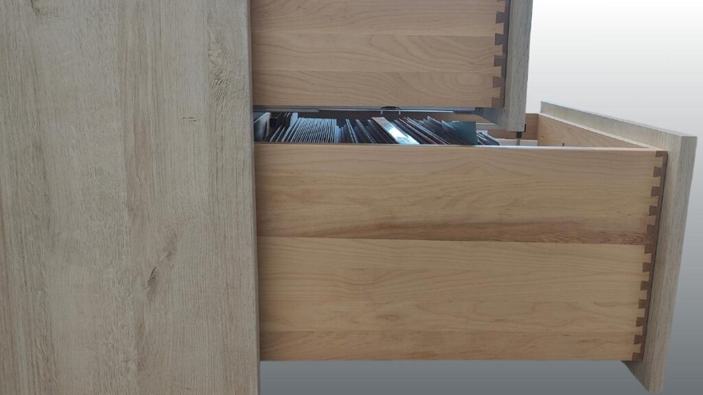 Two natural birch dovetail drawer boxes in a light grey cabinet.