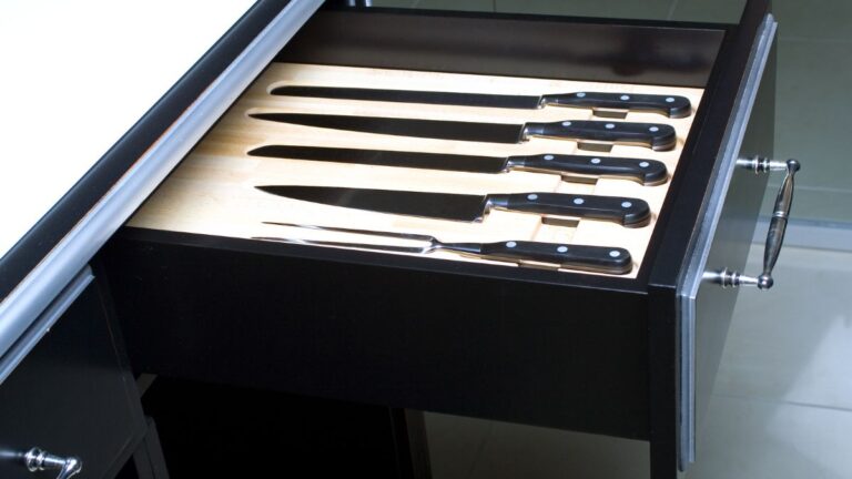 An in-drawer knife storage option in a black drawer box.