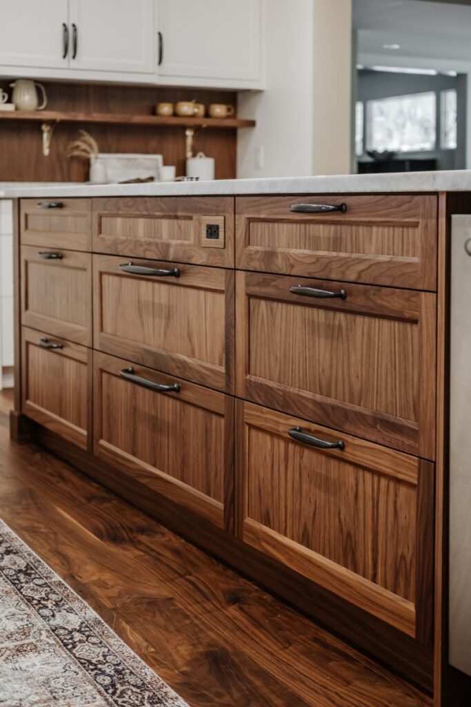 A bank of Walnut drawer fronts in a clear lacquer finish, which allows the wood to shine.
