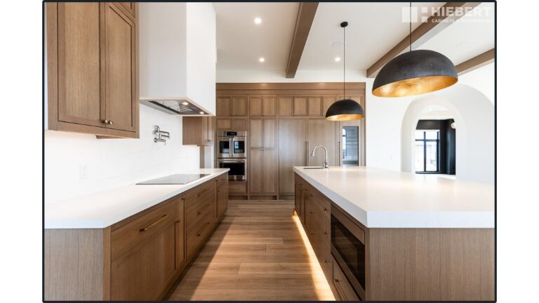 A kitchen featuring Rift Cut White Oak shaker style cabinet doors with a natural finish.