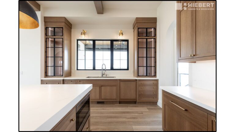 Cabinet doors with a light stain; the stain looks different on the solid wood pieces than on the plywood.