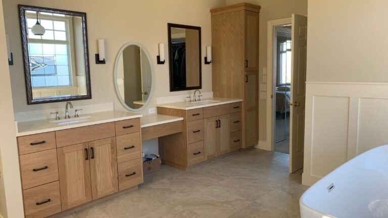 A vanity featuring Flat Cut White Oak doors. Flat Cut White Oak is less expensive than Rift Cut White Oak but also less consistent.