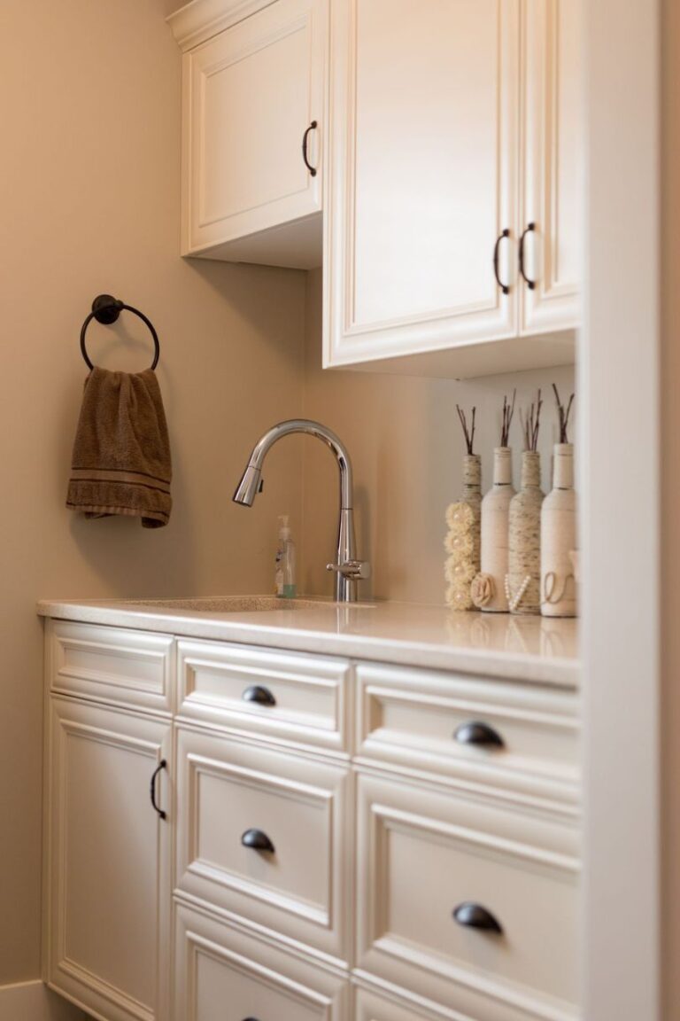 A bank of cabinets with white painted mitred cabinet doors.