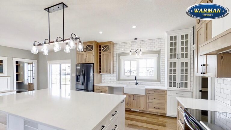 A kitchen with a combination of Hickory and white painted MDF cabinet doors.