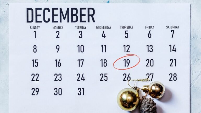 A December calendar page with gold ornaments and a pine cone in the bottom right-hand side. December 19 is circled in red; Cutting Edge Doors last production day is December 19.