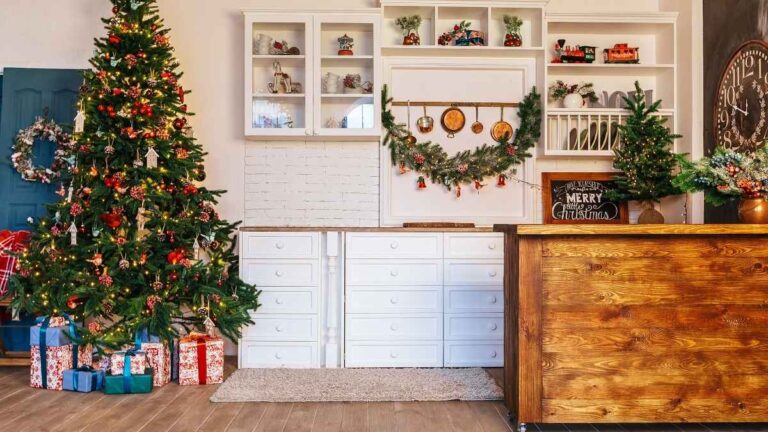 A living room with white painted cabinet doors, a Christmas tree, and Christmas decorations. While Cutting Edge Doors offers rush orders, you should still order as early as possible to avoid delays.