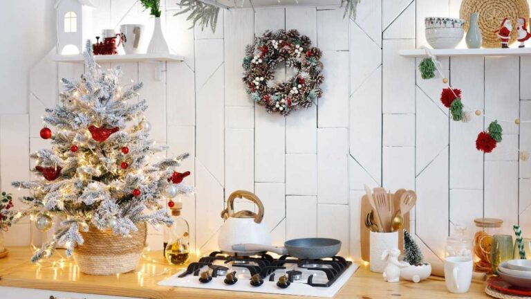 A white painted kitchen with Christmas decorations. Cutting Edge Doors & Woodworking shuts down over the holiday season so order your custom cabinet doors early.