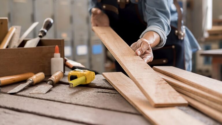 A person holding a board of wood. It's easy to start working with Cutting Edge Doors - your first step is to request your contractor account.