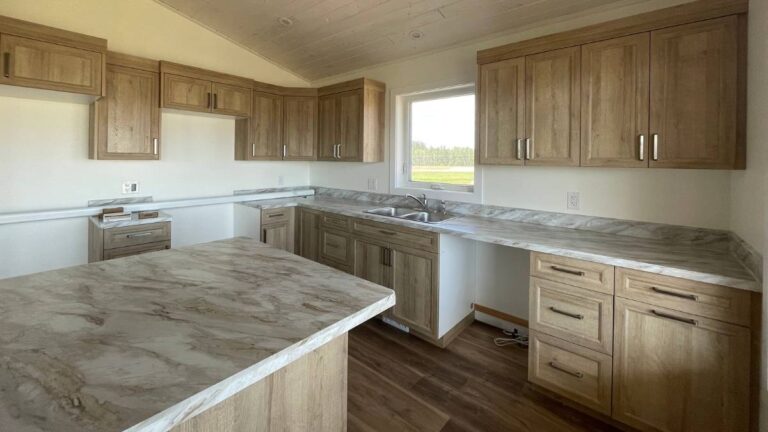 A kitchen with medium-brown woodgrain NEXGEN cabinet doors. If you're only customizing the sizes of the cabinet doors, and don't require your supplier to paint or stain the doors, you can safely order two to three weeks early.