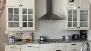 A kitchen with white painted cabinet doors. Armstrong Painting & Renovation works with homeowners in Edmonton.