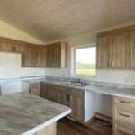 A kitchen with light-brown woodgrain NEXGEN cabinet doors. NEXGEN cabinet doors from Cutting Edge typically ship with 8-10 working days.