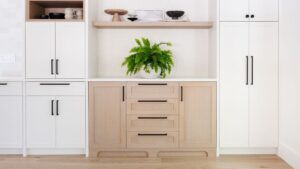 A transitional kitchen with a combination of white painted and whitewashed Rift Cut White Oak doors. Chris Murray Custom Cabinets works with homeowners in Regina.