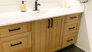 A vanity featuring quarter sawn White Oak cabinet doors and drawer fronts. Lome Carpentry works with homeowners and businesses in Regina.