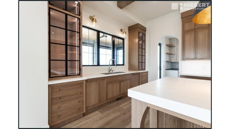 A kitchen with a combination of 5-piece and slab Rift Cut White Oak doors. The drawer fronts are solid wood slabs.