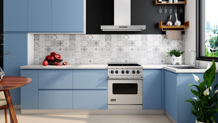 A kitchen featuring blue matte slab cabinet doors.