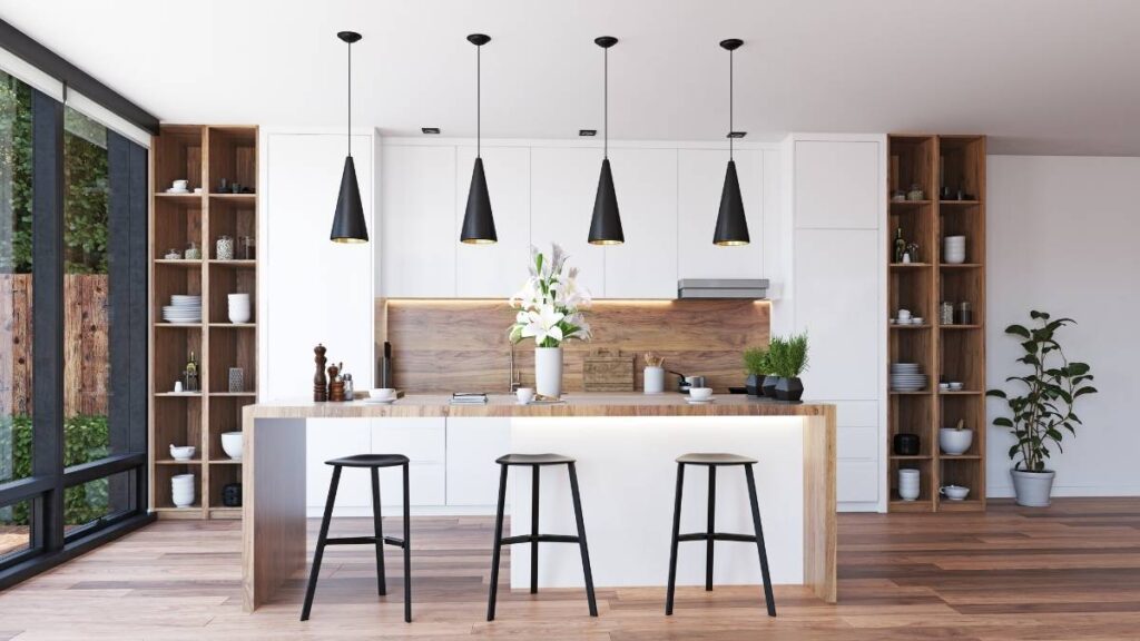 A kitchen featuring matte white slab cabinet doors with wood accents and countertops.