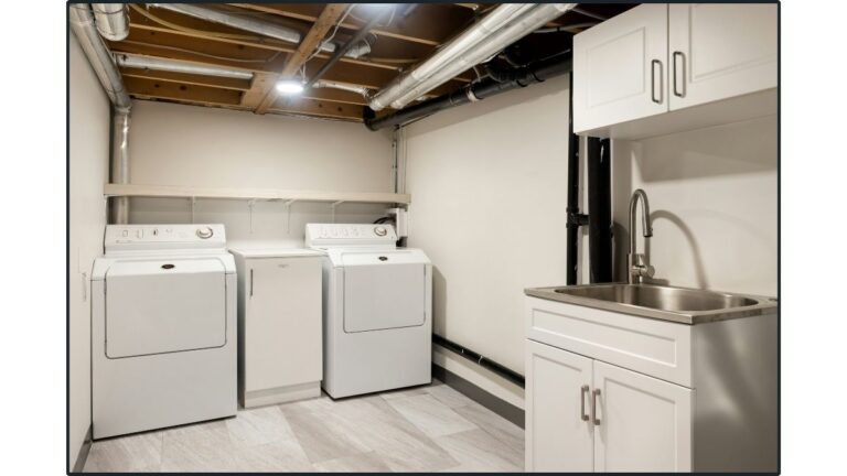 The upper cabinets in this laundry room feature white thermofoil cabinet doors.