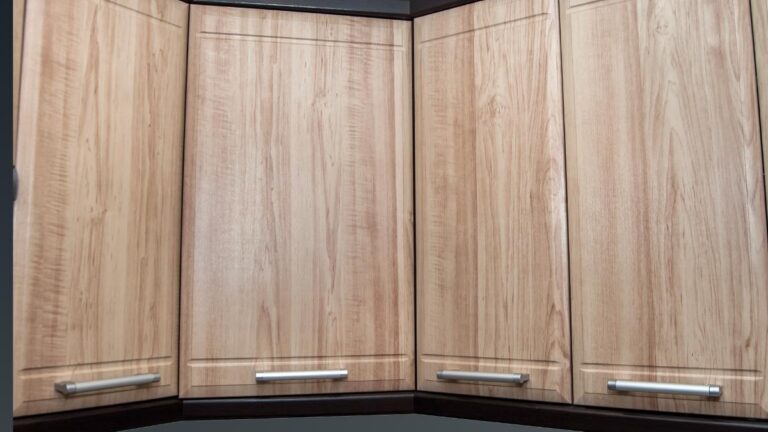 A bank of brown wood-grain thermofoil cabinet doors.