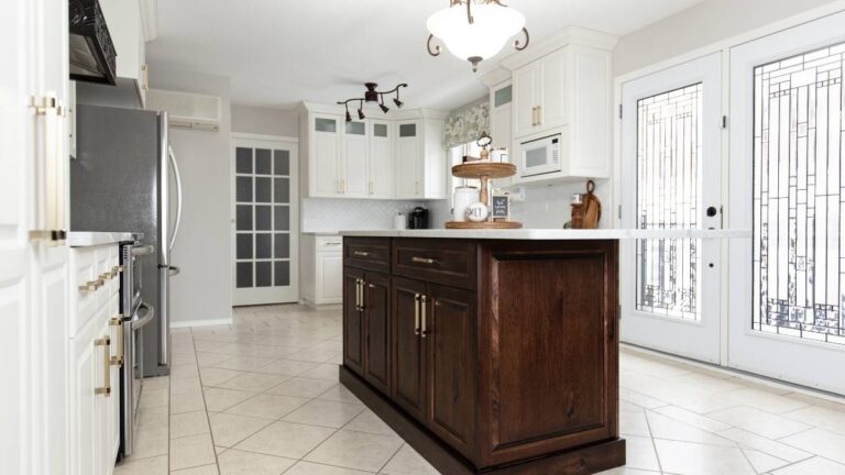 A wiping stain finish typically produces a richer, deeper finish. This kitchen features an island with dark-brown stained Red Oak cabinet doors.