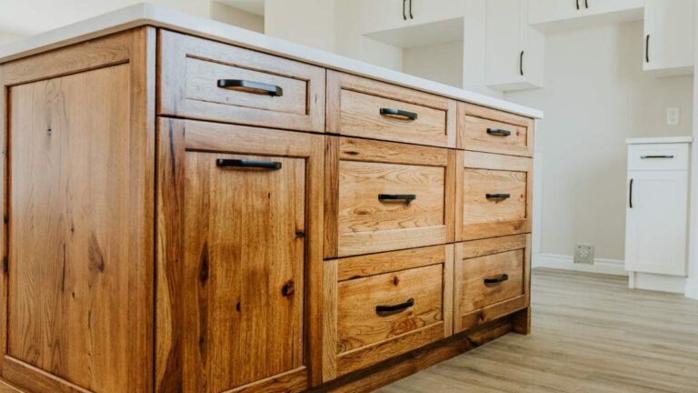 A kitchen island with knotty grade cabinet doors. At Cutting Edge, open knots and machining defects are not acceptable in knotty doors.